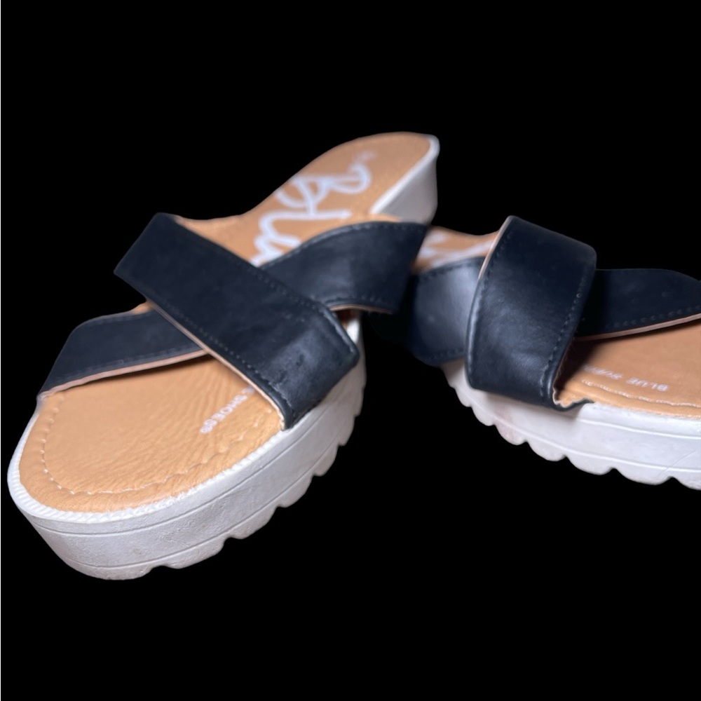 Black and white leather sandals